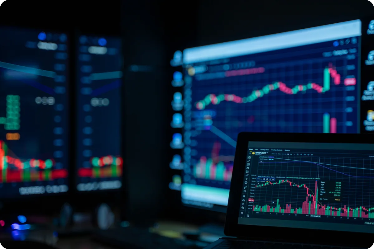 Candlestick price charts across several trading screens